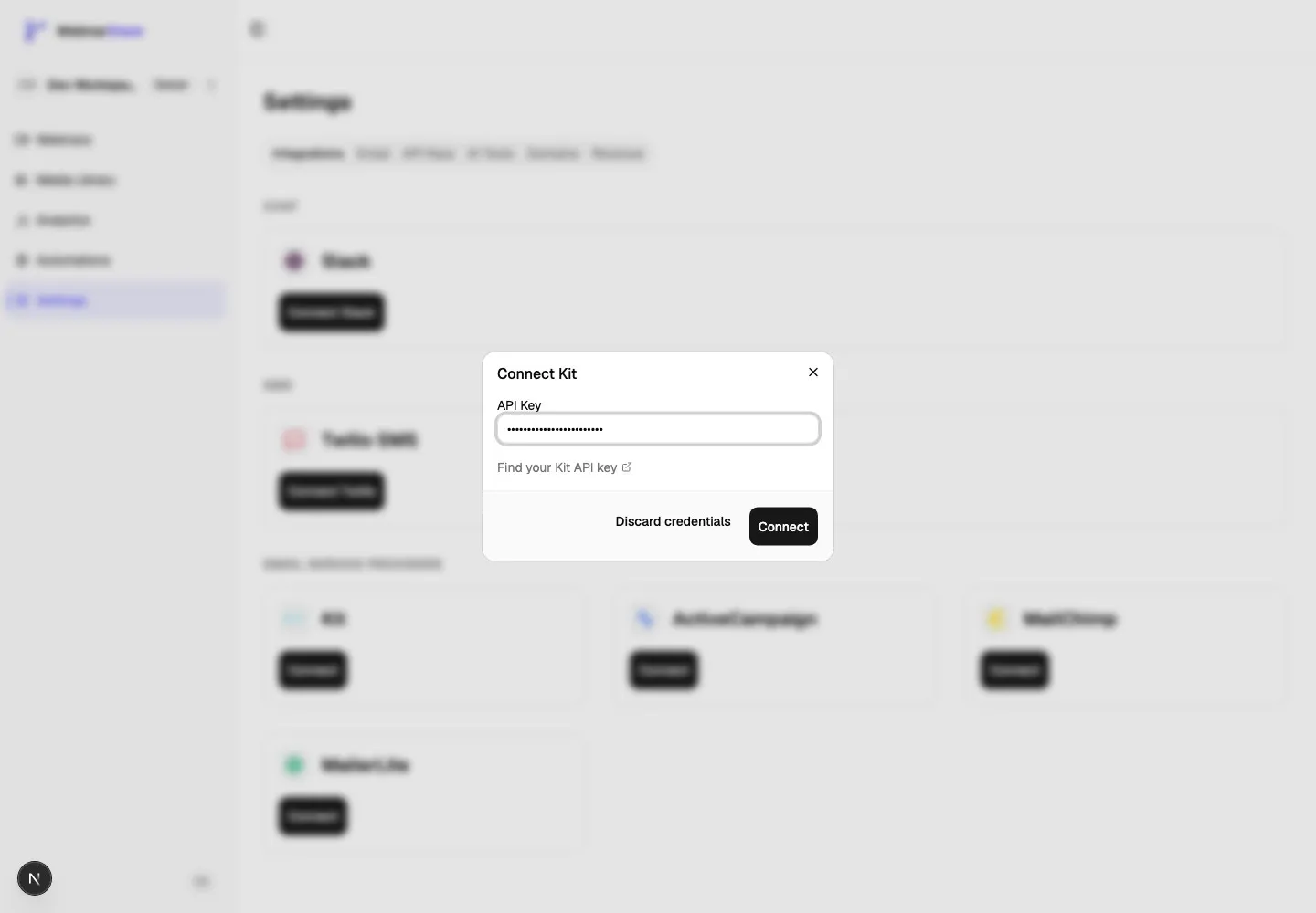 Connect Kit dialog showing the API Key field, the Kit API key help link, Discard credentials, and Connect button