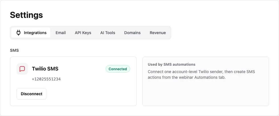 Settings Integrations page showing the SMS section with the Twilio SMS card, connected badge, sender phone number, and disconnect button